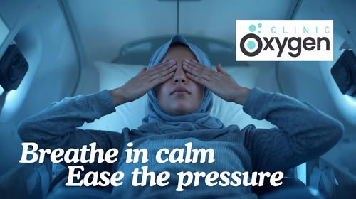 Woman relaxing in a wellness chamber during oxygen therapy session for migraine relief, symbolising calm recovery, natural healing, and stress reduction.